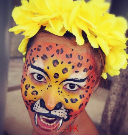 Orange and yellow leopard face painting 