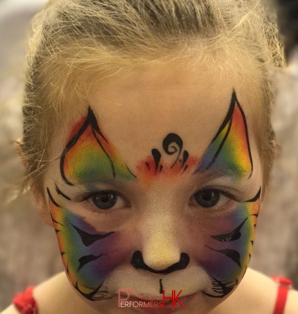 young child with tiger facepaint