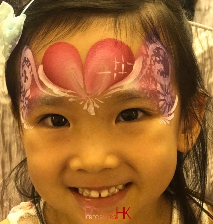 young child with face painting