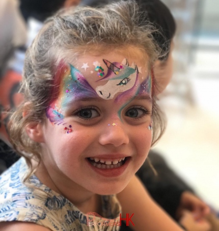 unicorn face painting on little girls face