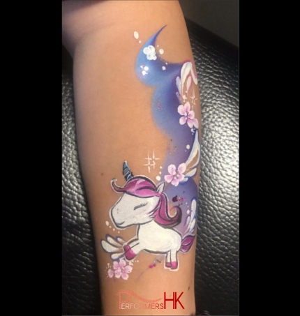 rainy blue cloud unicorn painted on arm