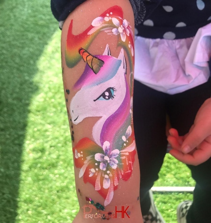 party Unicorn painted on arm