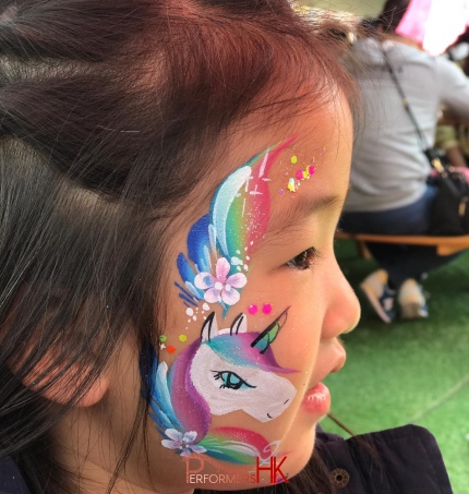 unicorn face painted on face by rainy on little girl