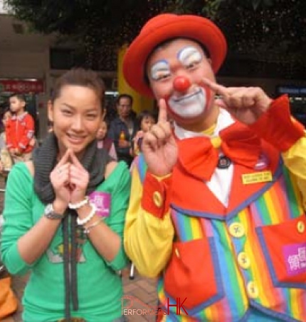 Roving clown taking picture with with TVB artist Tsui Zi San at a Hong Kong corporate function 