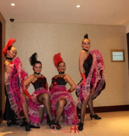 Four Can Can dancers dancing in pink and black dresses at HKCEC 