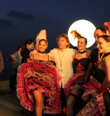 cancan dancers taking photos with guests at HKCEC