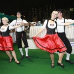 Two pairs of Bavarian dance dancers during their performance at the Jockey Club. 