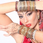 A closer look at the colourful and delicate bangles as well as  bold makeup Bollywood dancers wear.  