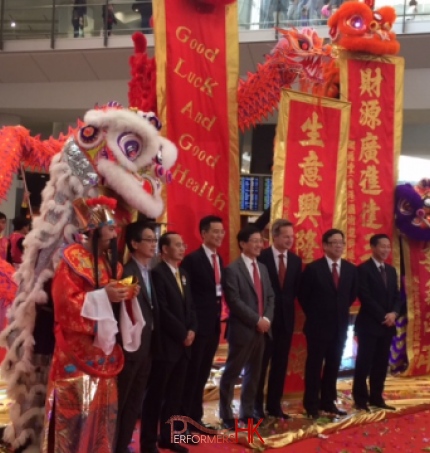 HK Choi Sun performer and lion dance dancer taking photo with the management after the Chinese new year kick off Ceremony at the airport