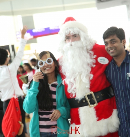 Santa posing with patrons at Hong Kong airport