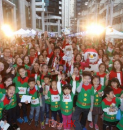 Hong Kong performer dress as Santa Claus and snow man with 400 participants who dress as Elf taking picture at Swire Properties three-day Christmas street fair in Tai Koo Place, Quarry Bay.
