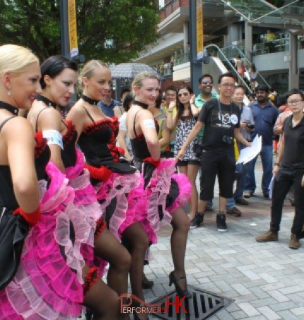 Dancers in pink costume posing for photos in Hong Kong