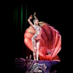 Contortion performer makes graceful movements in a shell. 