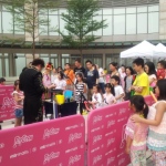 Wing Performing outdoor stage show at popcorn mall