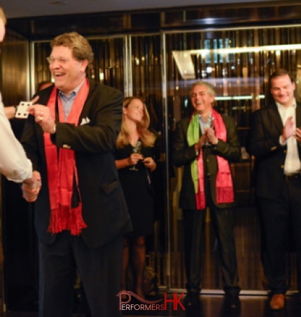 Magician in Hong Kong handshaking with a client after he amazed him with his card magic at a corporate event