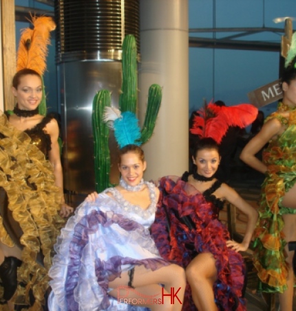 4 can can dancers posing for photo with different color can can costumes