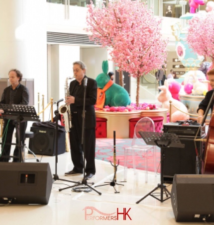 3 musicians playing in mall in HK. Sax, double bass, Keyboard trio 