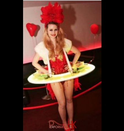 girl in red corset in table with canapes 