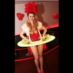 Model wearing LED human canape table costume with red corset