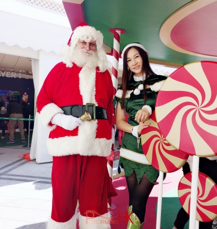 a santa in hong kong, doing an event with elf girl kimmy