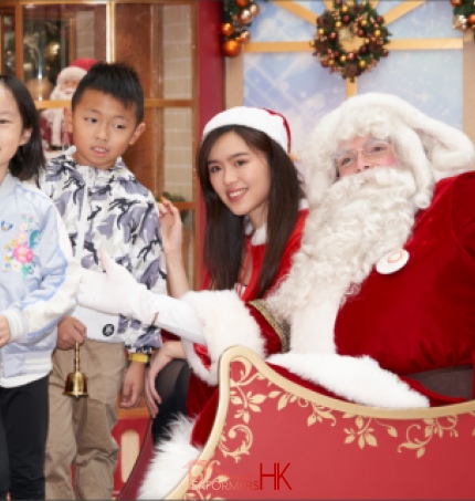 Santa with santa girl and kids
