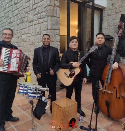 4 musicians carrying their instruments at an event in repulse bay Hong Kong