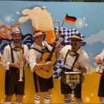 Band in front of backdrop for Oktoberfest at Gold Coast