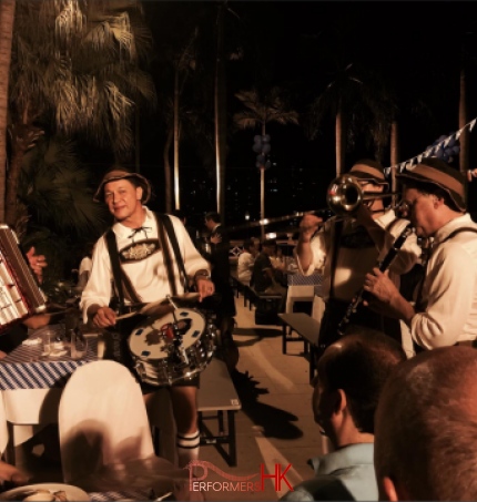 German walk around band in full costume walking around SOHO east Hong Kong, Sai Wan Ho area