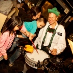 Andy interacting on the drums with baby playing the drums