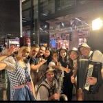 German duo Oktoberfest band at The Central Market 2022 event for Lowenbrau with Beer girls