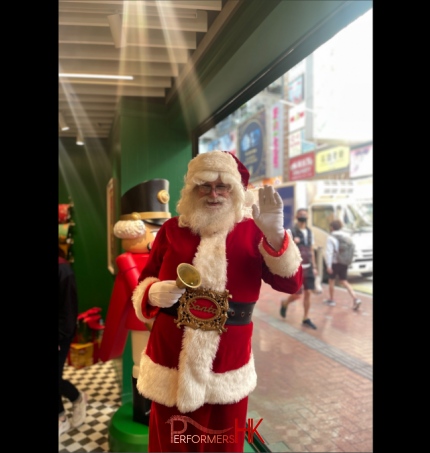Santa Martin saying hello to guests in front of HK causeway bay sogo store in his red suit and bell