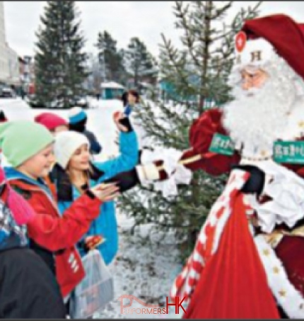 Local Santa Mario in Finland handing out gifts to kids
