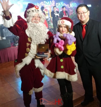 Santa Mario standing with Santa girl with doctor