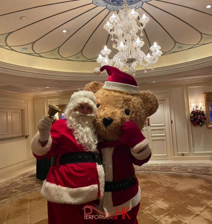 Santa with giant teddy bear mascot in TST Penninsula Hotel, 5 star hotel event, Hong Kong charity event for hotel group, with mascot performer in red Santa costume