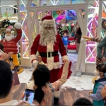 Santa Sean greeting happy shoppers at Mira mall TST Hong Kong with Santa girl. Performance from Santas HK