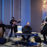 jazz quartet with conga in hong kong, musicians in black out fit ready to perform