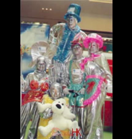 Five professional stilt-walker in sliver costume entertaining the visitor at a shopping mall function